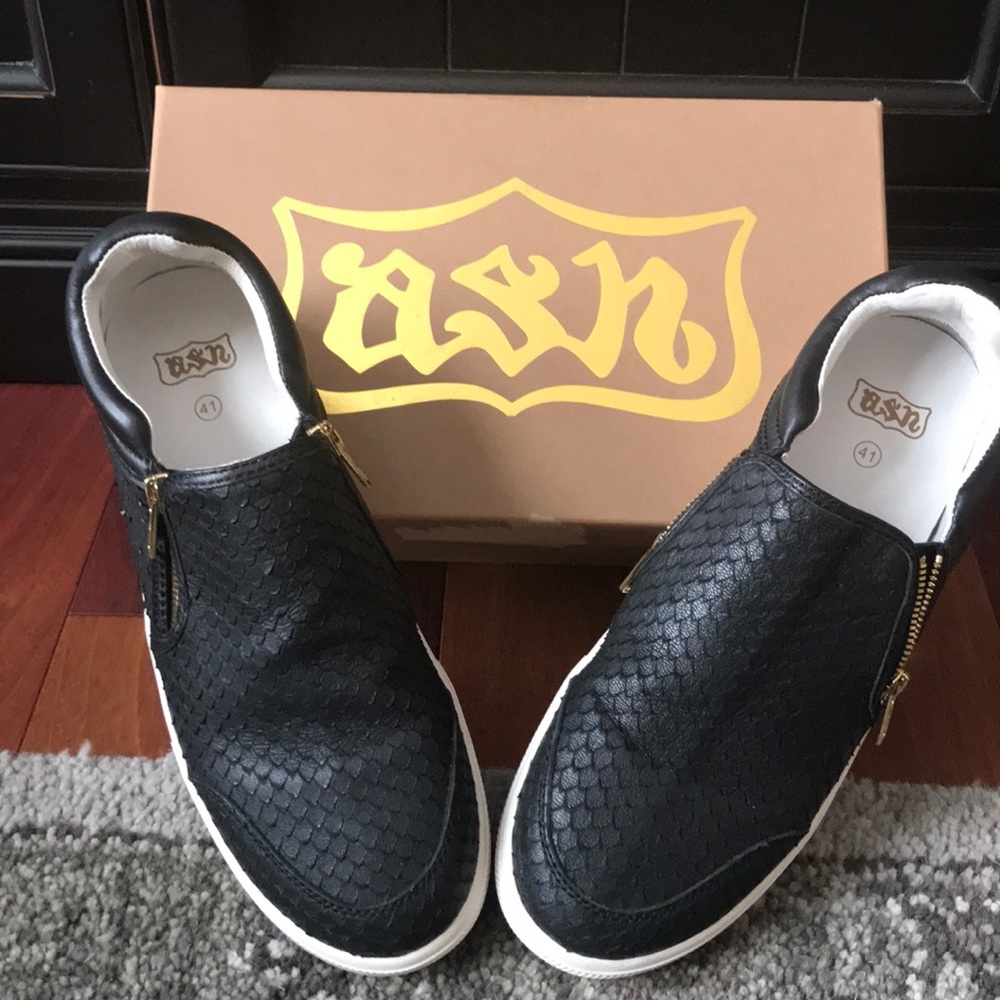 Black leather slip on sneakers